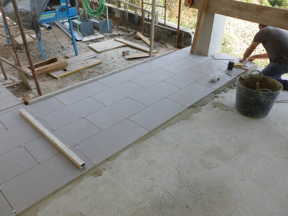 laying floor tiles