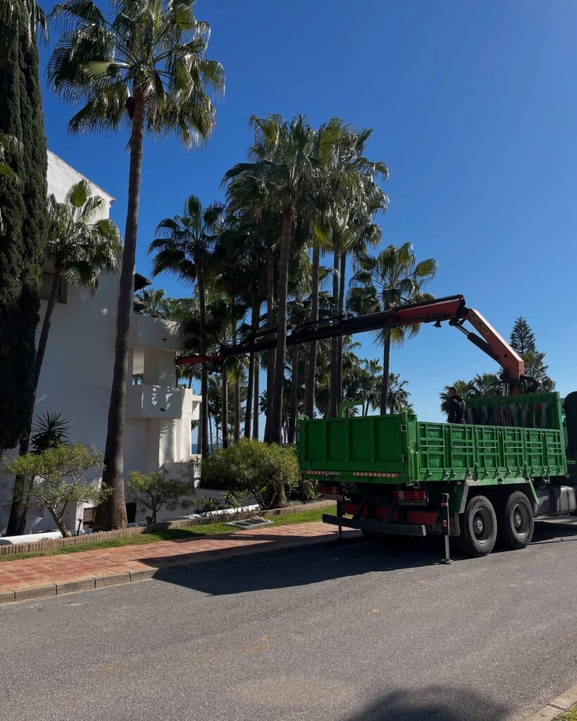 Crane outside house undergoing renovation